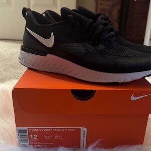Nike Women’s Black and White Odyssey React 2 Flyknit Sneakers